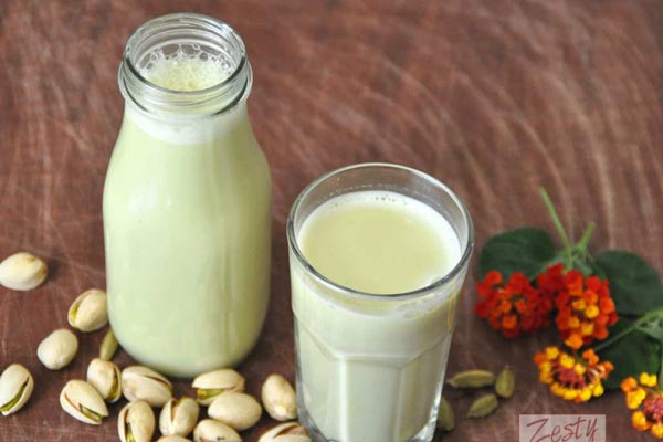 a glass of pistachio milk